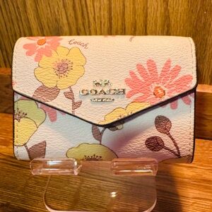 Floral Coach Card Case in Signature Canvas.